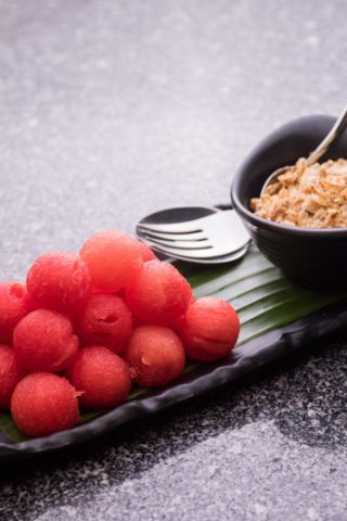 Cold watermelon served with dried fish flakes