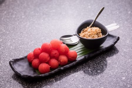 Cold watermelon served with dried fish flakes