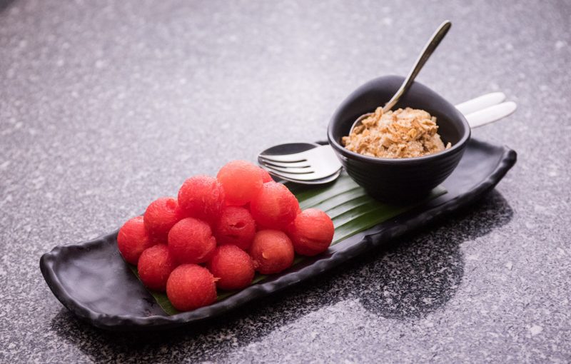 Cold watermelon served with dried fish flakes