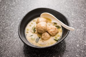 Fish ball stuffed with salted egg yolk in green curry