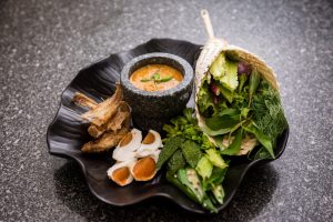 Crab roe relish served with a soft boiled egg