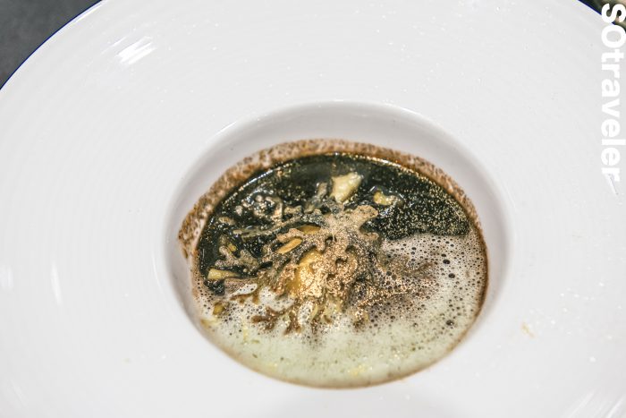 Bouillabaisse Black Ink Soup with Red Grouper Dumpling, Parsley Dill Foam and Seaweed Tuille